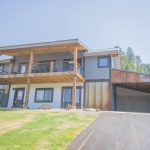 front of house with view of 3 sided attached garage