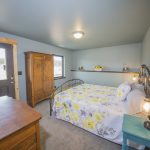 Alternate view of Yellow Floral Bedspread with a door leading to outside