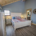 bedroom view with door leading to bathroom